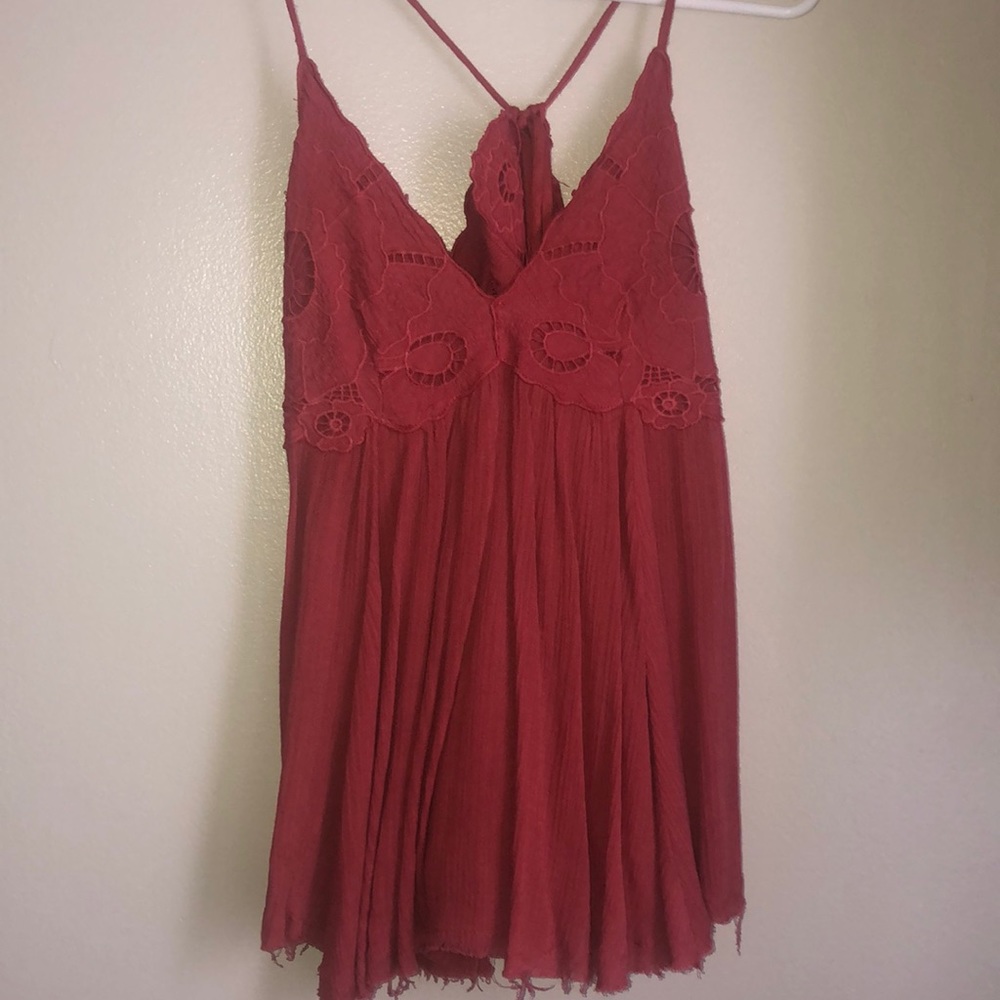 Flowy, open back tank. Adjustable in the back